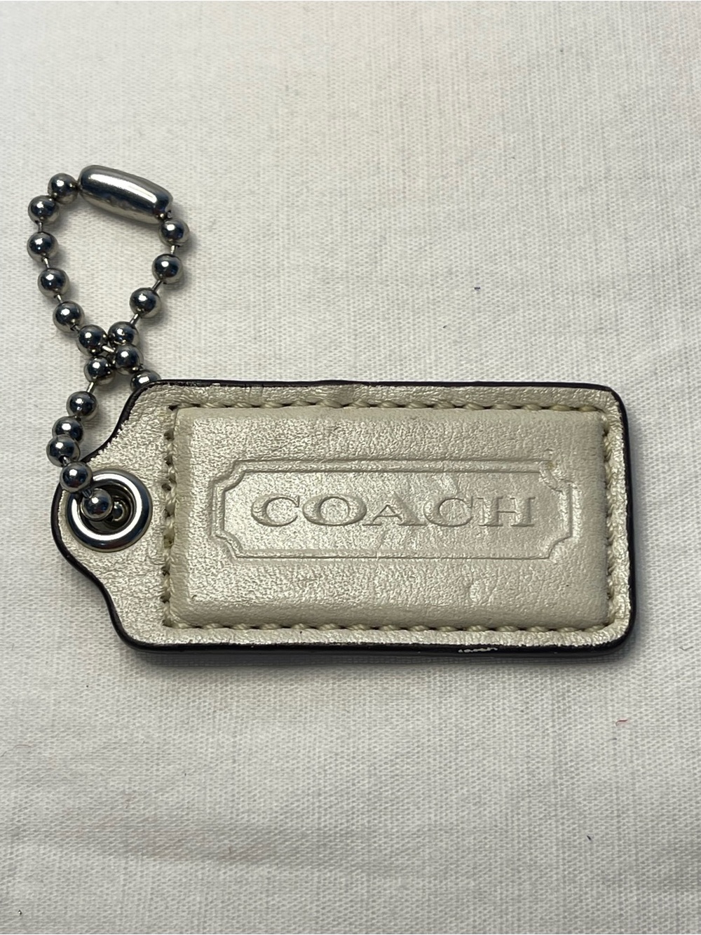 COACH Metallic Cream Leather Hang Tag with Ball Chain